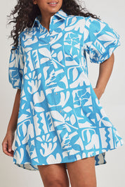 Model Terri-Leigh wearing size 14 of the Cotton A Line Shirt Dress in colour Garden (Blue), from the front, cropped image