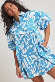 Model Terri-Leigh wearing size 14 of the Cotton A Line Shirt Dress in colour Garden (Blue), from the front, cropped image