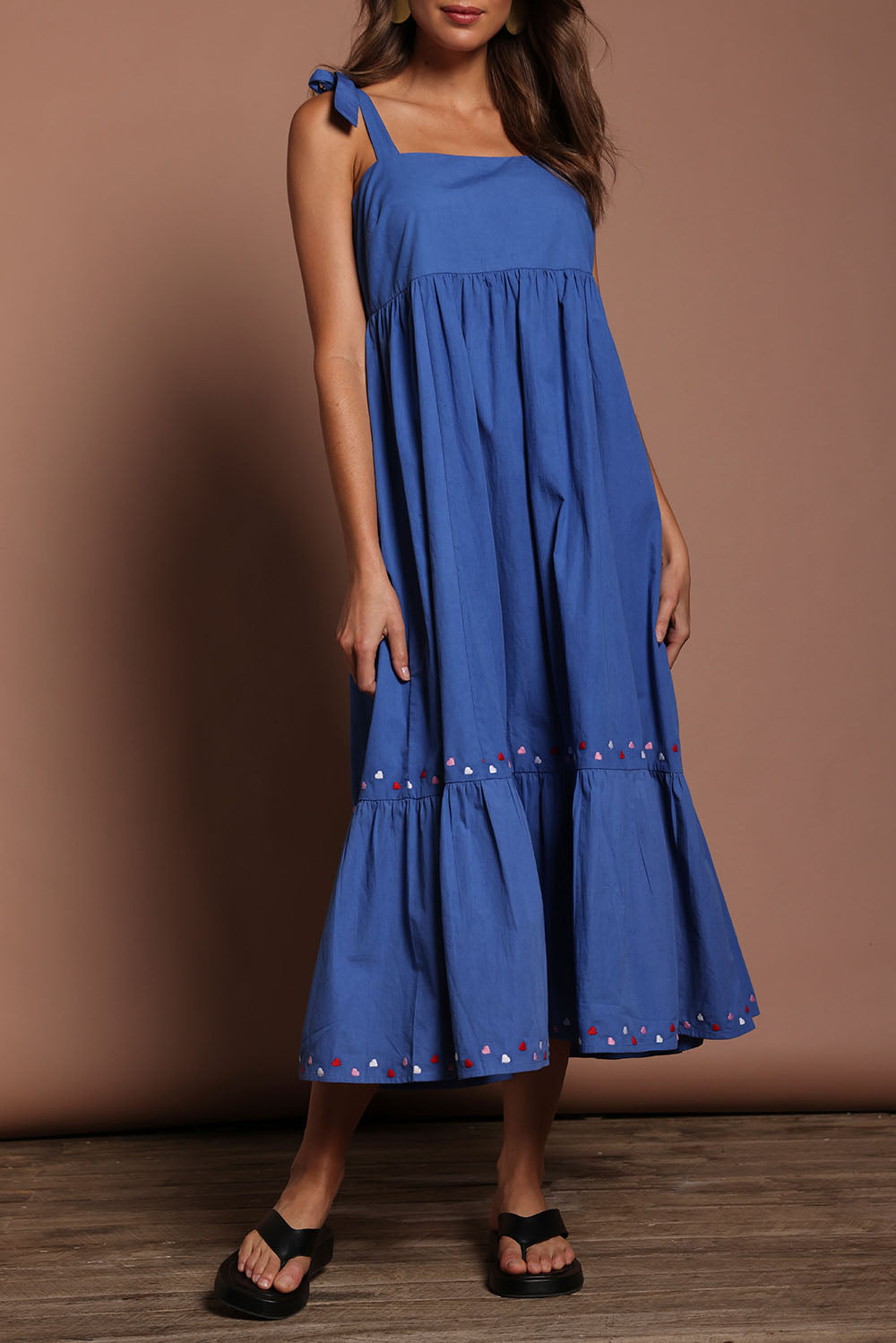 Model Madeline wearing size 10 of the Cotton Embroidered Midi Dress in colour Blue (Blue), from the front, cropped image