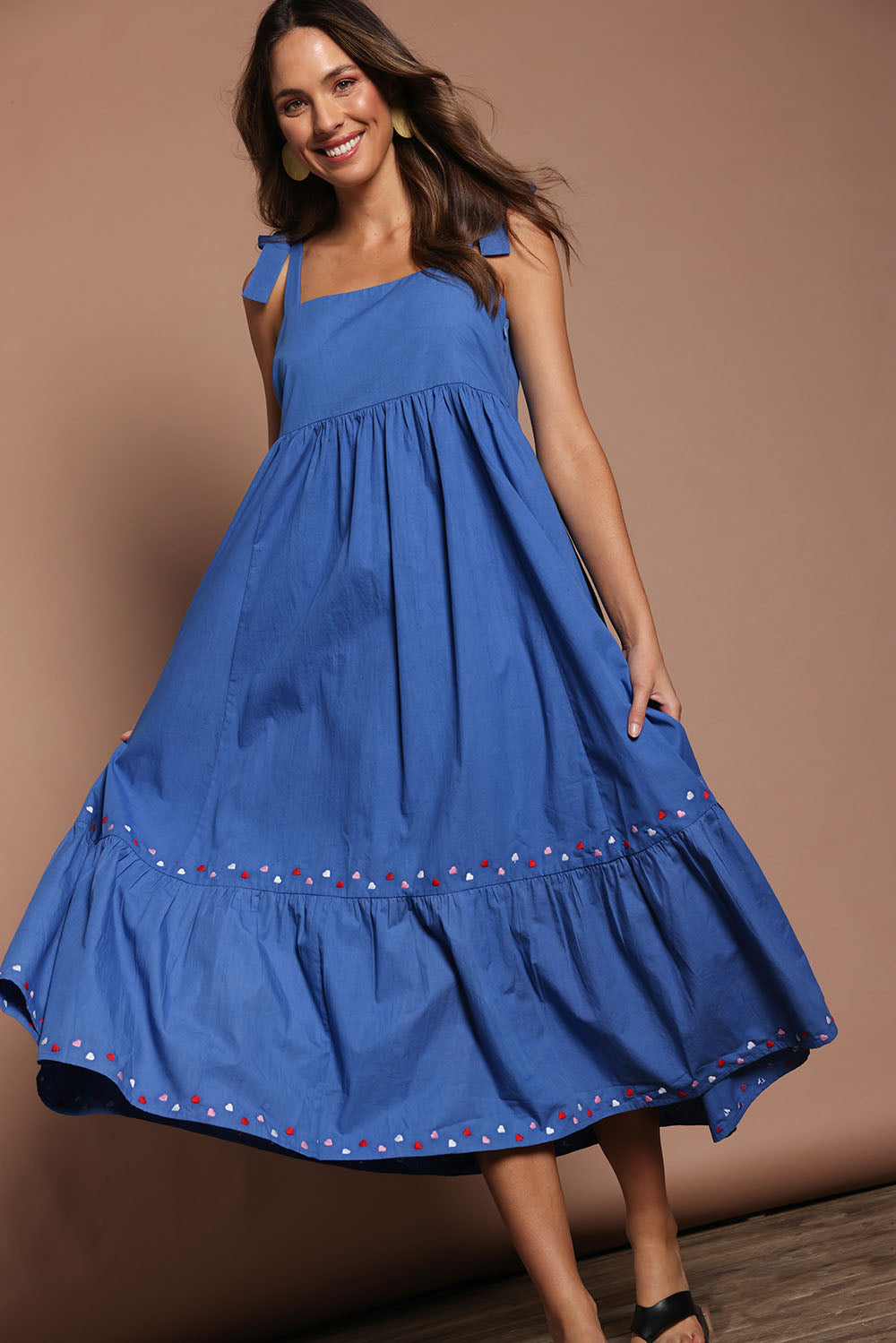Model Madeline wearing size 10 of the Cotton Embroidered Midi Dress in colour Blue (Blue), from the front, showing the whole outfit