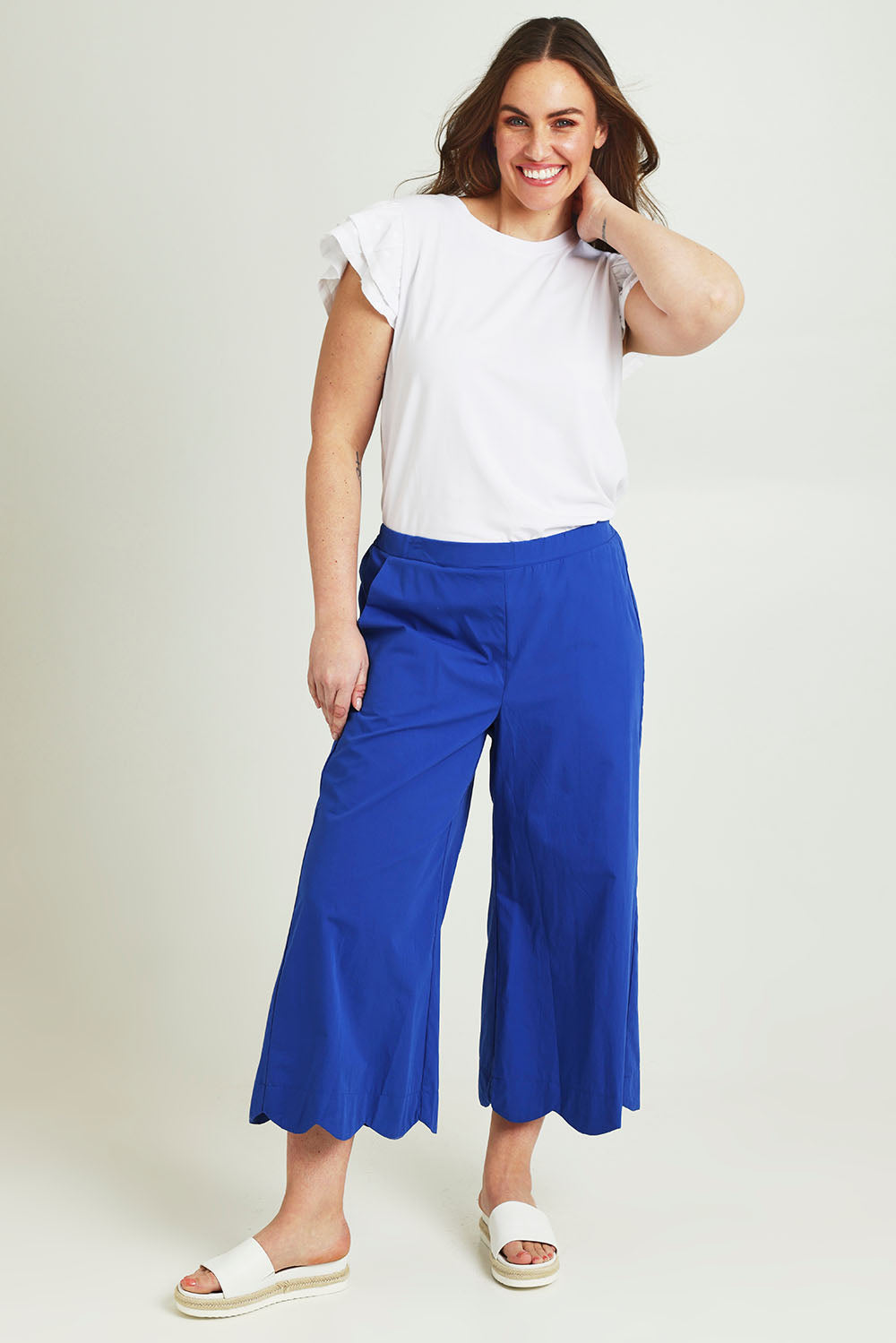 Model Jane wearing size 14 of the Scalloped Hem Cotton Pant in colour Palaceblue (Blue), from the front, showing the whole outfit