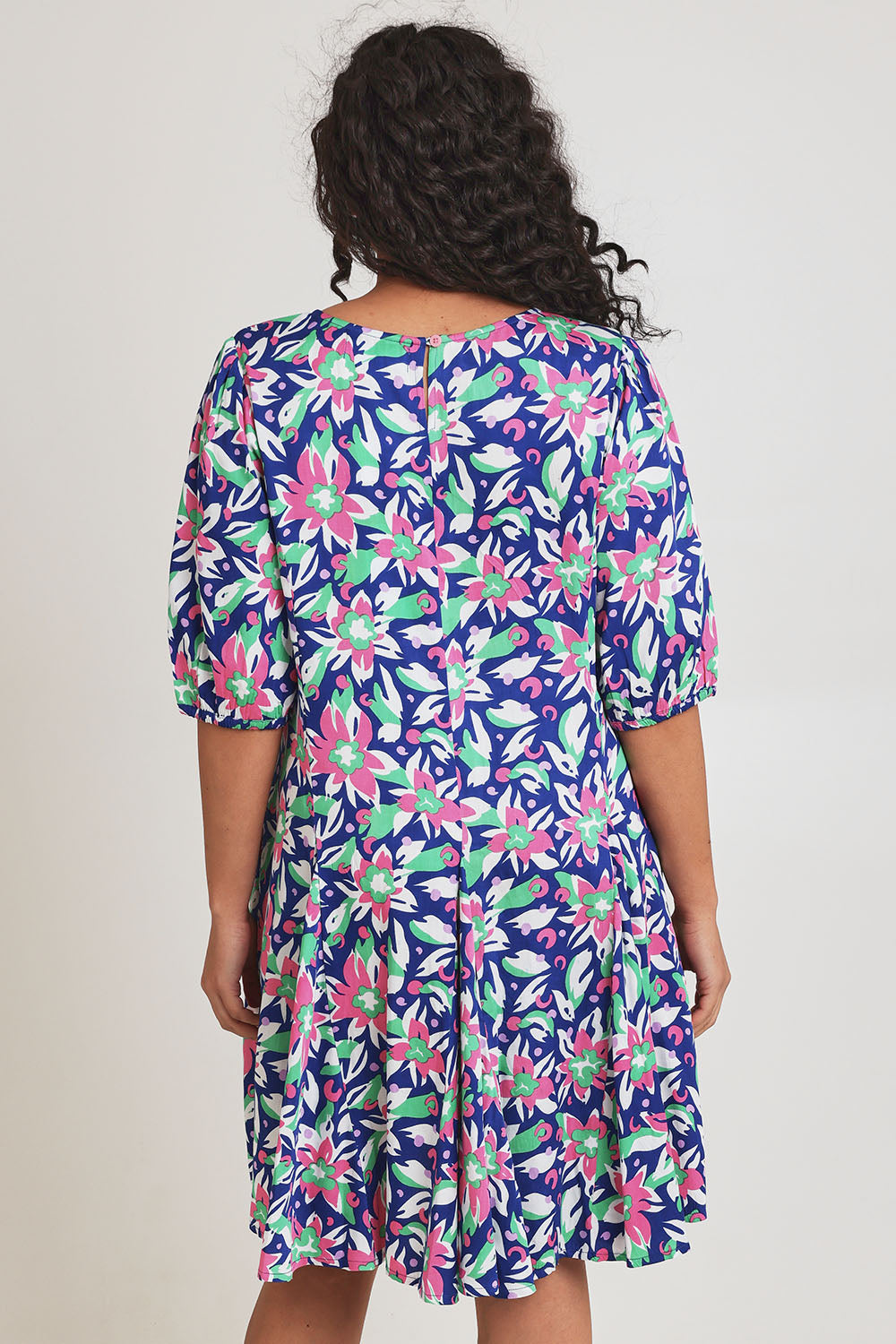 Model Terri-Leigh wearing size 14 of the Flared Hem Dress in colour Floral, from the back