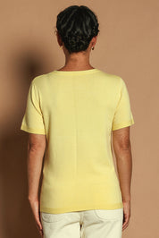 Model Katie wearing size S of the Short Sleeve Knit Top in colour Yellow, from the back