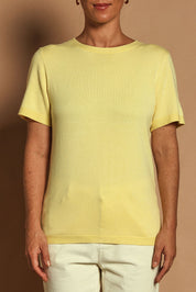 Model Katie wearing size S of the Short Sleeve Knit Top in colour Yellow, from the front, cropped image