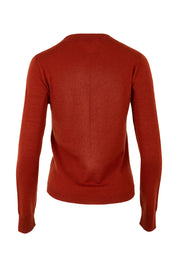 Product shot of the Extra Fine Merino Wool Long Sleeve Knit in colour Rust, from the back