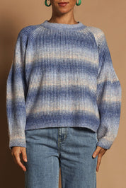 Model Katie wearing size S of the Space Dyed Yarn Crewneck Sweater in colour Dusk (Blue), from the front, cropped image