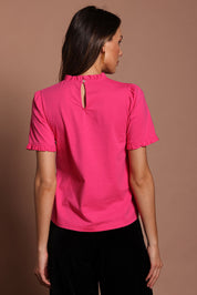 Model Madeline wearing size 10 of the Mercerised Cotton Frill Top in colour Pinkrose (Pink), from the back