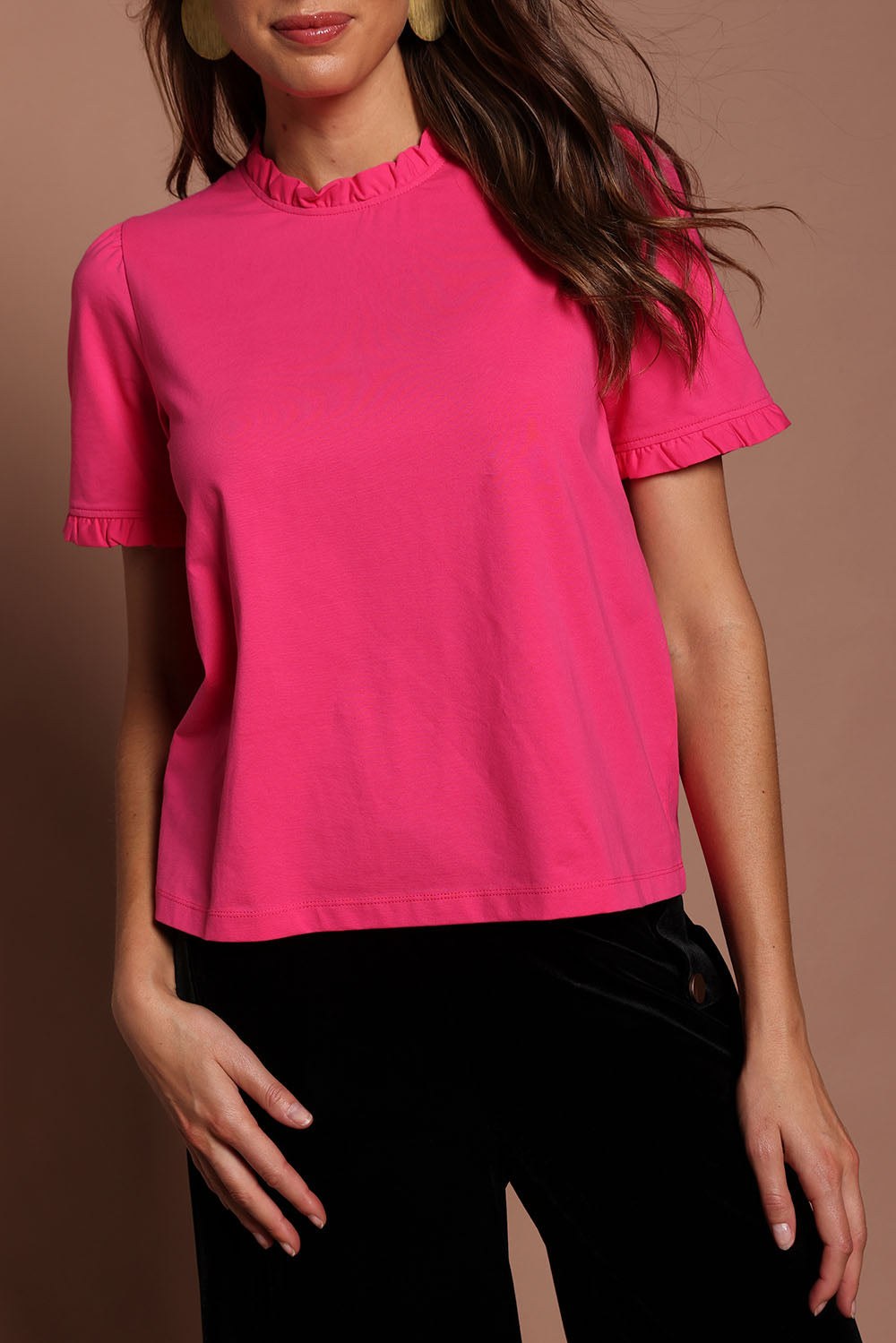 Model Madeline wearing size 10 of the Mercerised Cotton Frill Top in colour Pinkrose (Pink), from the front, cropped image