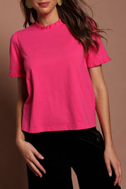 Model Madeline wearing size 10 of the Mercerised Cotton Frill Top in colour Pinkrose (Pink), from the front, cropped image
