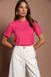 Model Madeline wearing size 10 of the Mercerised Cotton Frill Top in colour Pinkrose (Pink), from the front, cropped image