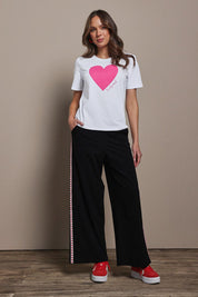 Model Madeline wearing size 10 of the Mercerized Cotton Love Tee in colour Pinkheart (Pink), from the front, showing the whole outfit