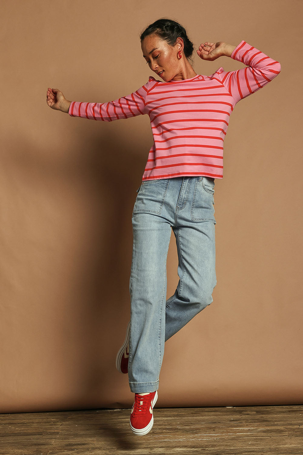 Model Katie wearing size 10 of the Cotton Stripe Long Sleeve Top in colour Redpink (Pink), from the front, showing the whole outfit