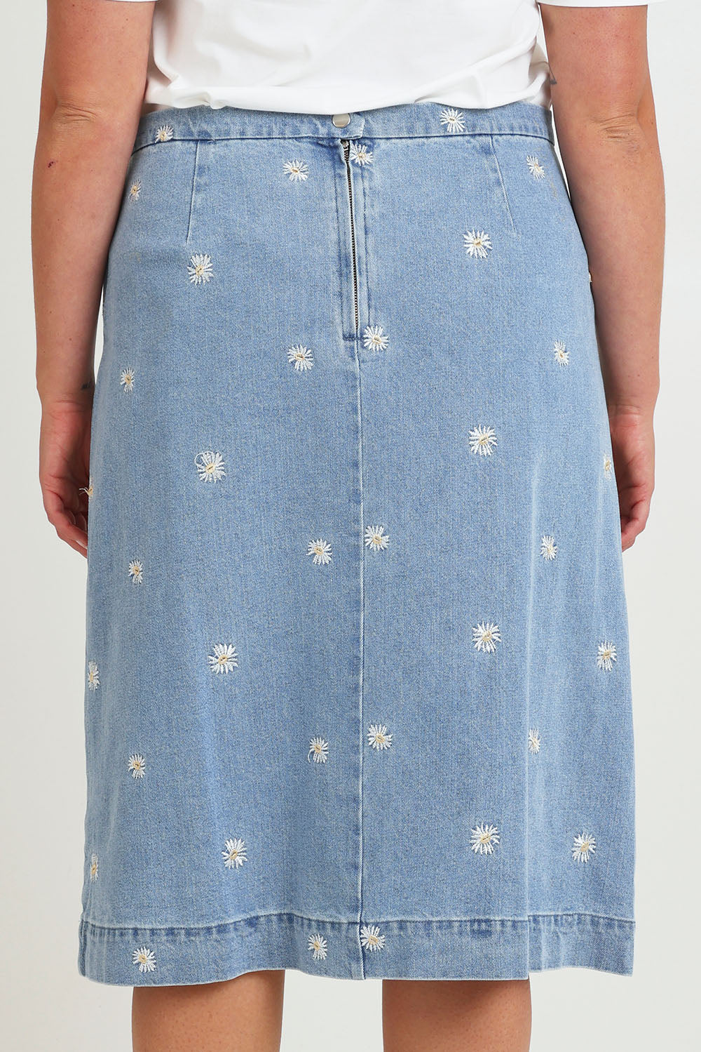 Model Chanel wearing size 16 of the Daisy Denim A Line Skirt in colour Daisy (Blue), from the back