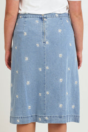 Model Chanel wearing size 16 of the Daisy Denim A Line Skirt in colour Daisy (Blue), from the back