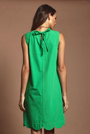 Model Madeline wearing size 10 of the Cotton Shift Dress in colour Green (Green), from the back