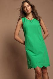 Model Madeline wearing size 10 of the Cotton Shift Dress in colour Green (Green), from the front, cropped image