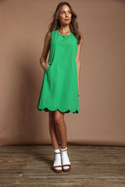 Model Madeline wearing size 10 of the Cotton Shift Dress in colour Green (Green), from the front, showing the whole outfit