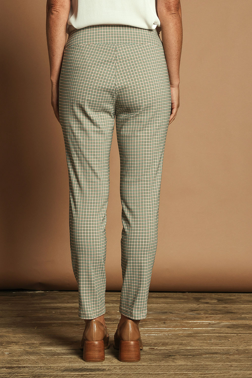 Model Katie wearing size 10 of the Pull On Check Pants in colour Mintcheck (Blue), from the back