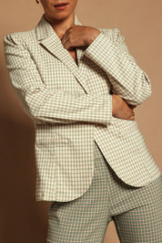 Model Katie wearing size 10 of the Classic Check Blazer in colour Pinkcheck (Pink), from the front, cropped image