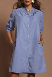 Model Madeline wearing size 10 of the Cotton Button Up Dress in colour Wisteria (Purple), from the front, cropped image