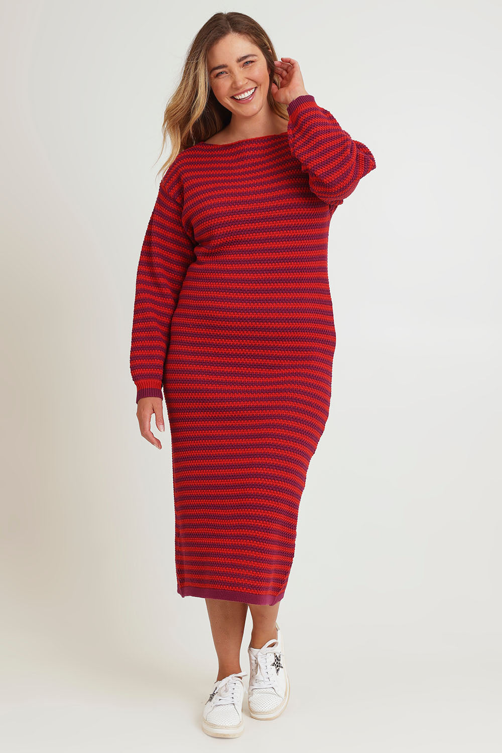 Model Chanel wearing size XL of the Cotton Stripe Knit Dress in colour Redpurple (Red), from the front, showing the whole outfit