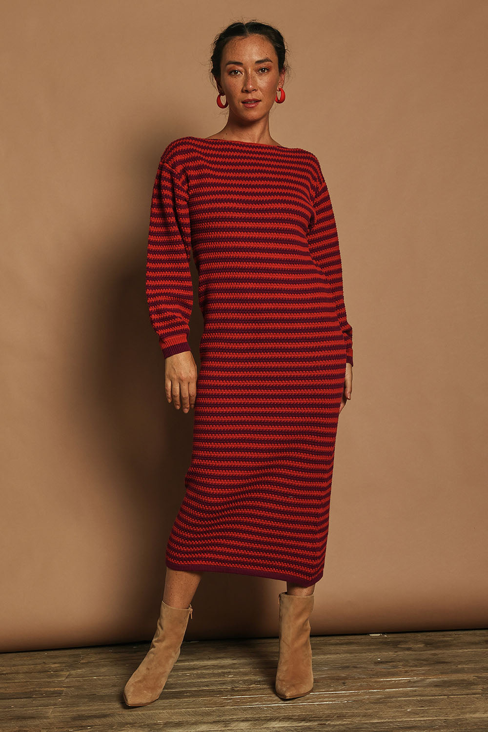 Model Katie wearing size S of the Cotton Stripe Knit Dress in colour Redpurple (Red), from the front, showing the whole outfit