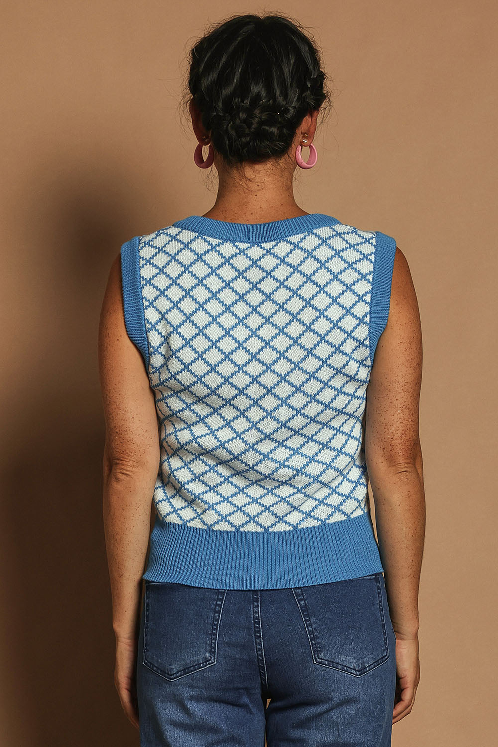 Model Katie wearing size S of the Cotton Blend V Neck Vest in colour Bluewhite (Blue), from the back