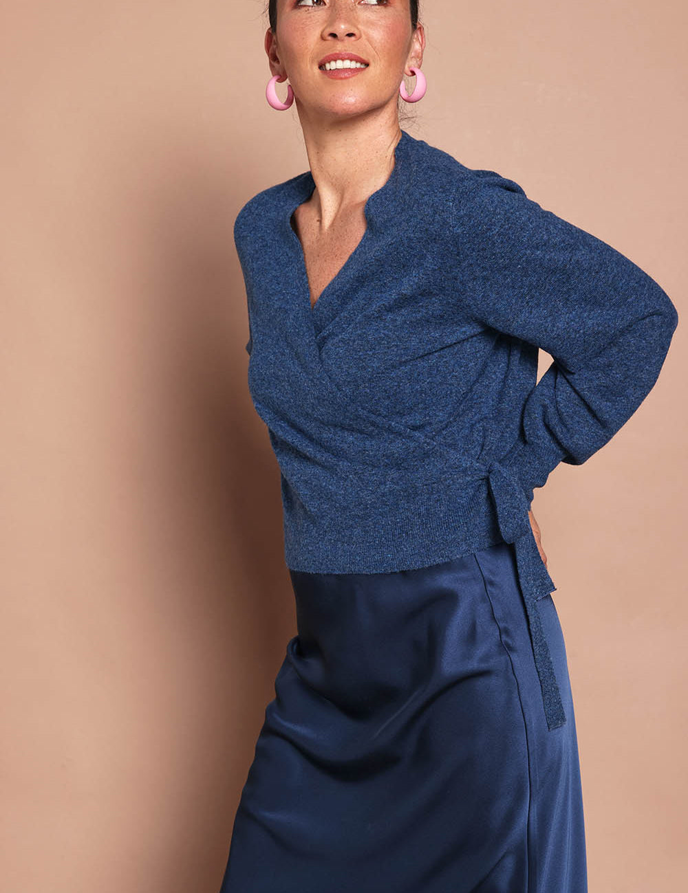 Model Katie wearing size S of the Wrap Knit Sweater in colour Dustyblue (Blue), from the front, cropped image