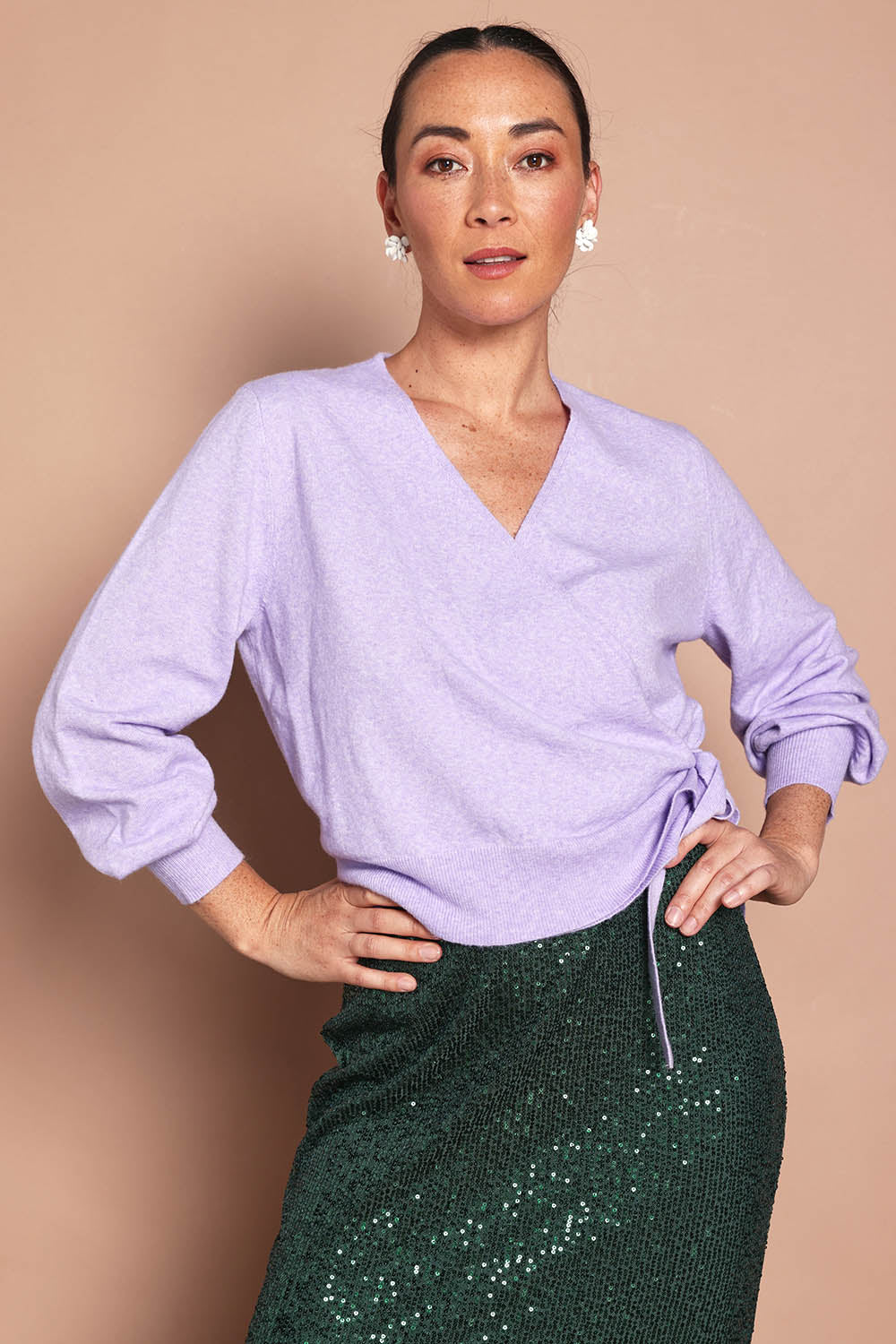 Model Katie wearing size S of the Wrap Knit Sweater in colour Lilac (Purple), from the front, cropped image