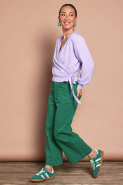 Model Katie wearing size S of the Wrap Knit Sweater in colour Lilac (Purple), from the front, showing the whole outfit