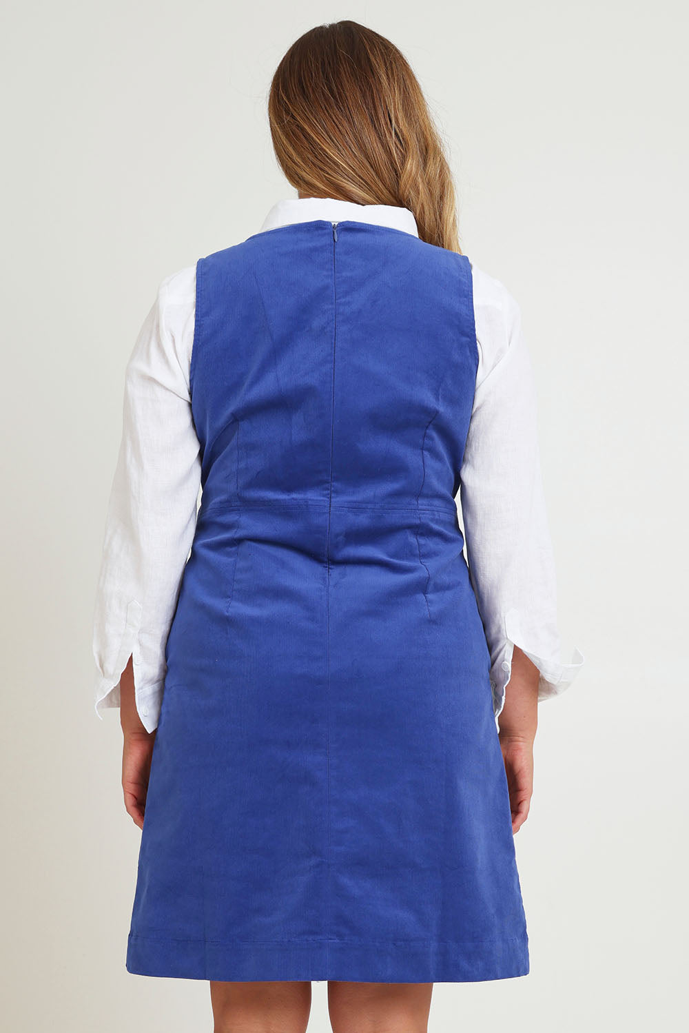 Model Chanel wearing size 16 of the Corduroy Shift Dress in colour Bonnie (Blue), from the back