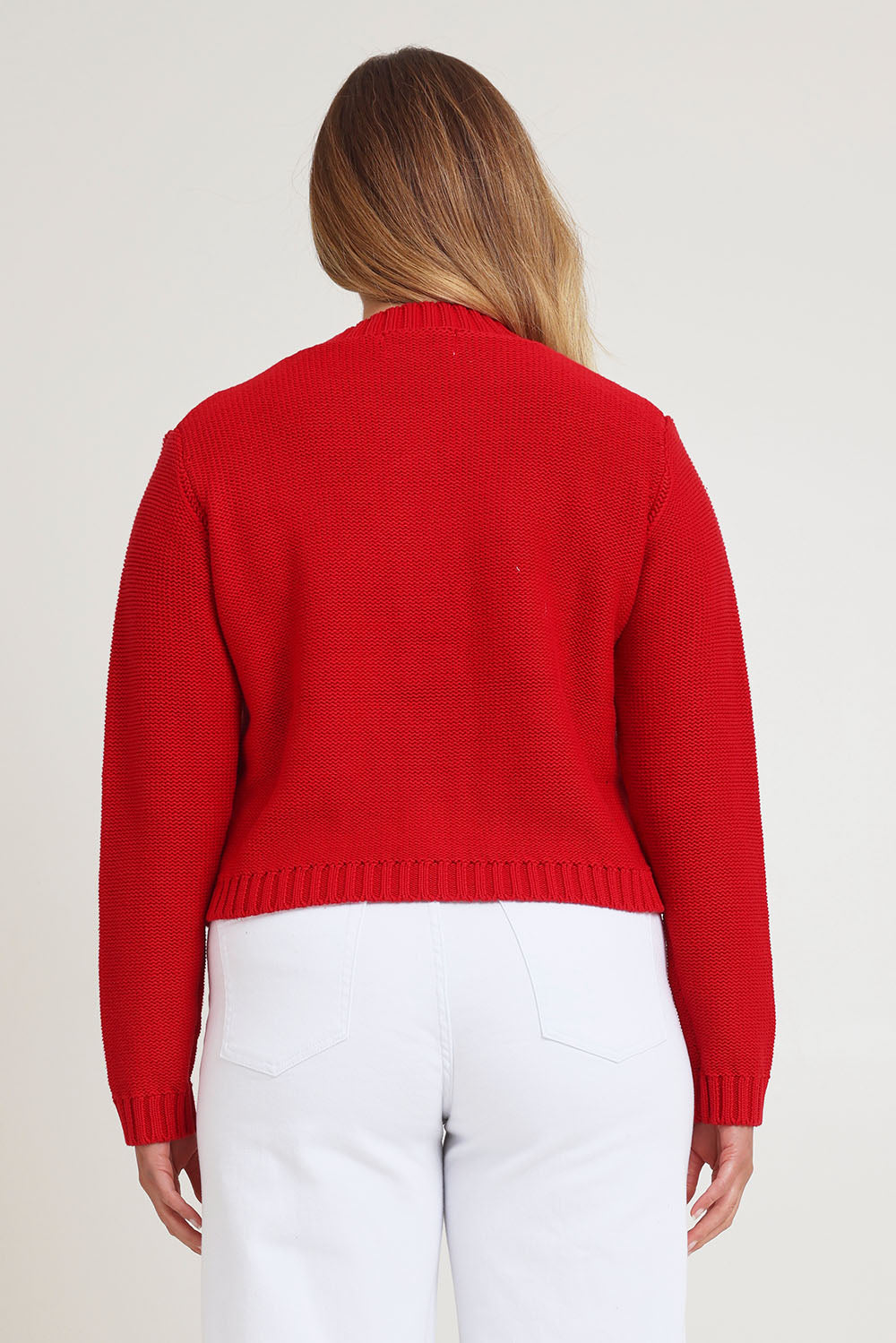 Model Chanel wearing size XL of the Cotton Cardigan in colour Red (Red), from the back