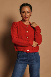 Model Katie wearing size S of the Cotton Cardigan in colour Red (Red), from the front, showing the whole outfit