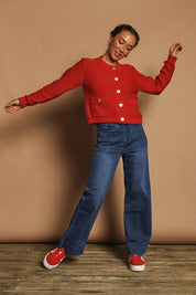 Model Katie wearing size S of the Cotton Cardigan in colour Red (Red), from the front, showing the whole outfit