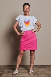 Model Katie wearing size 10 of the Cotton Stretch Pocket Skirt in colour Pink (Pink), from the front, showing the whole outfit