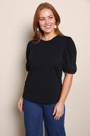 Model Georgiel wearing size 10 of the Cotton Jersey Puff Sleeve Top – Black in colour Black, in a cropped view