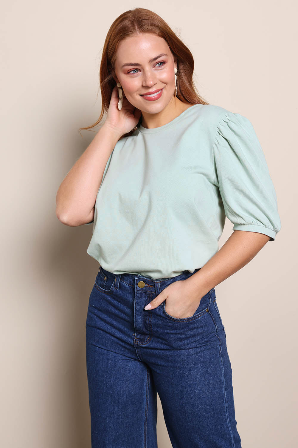 Model Georgiel wearing size 10 of the Cotton Jersey Puff Sleeve Top – Lightsage in colour Lightsage, in a cropped view