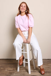 Model Georgiel wearing size 10 of the Cotton Jersey Puff Sleeve Top – Pink in colour Pink, from the front