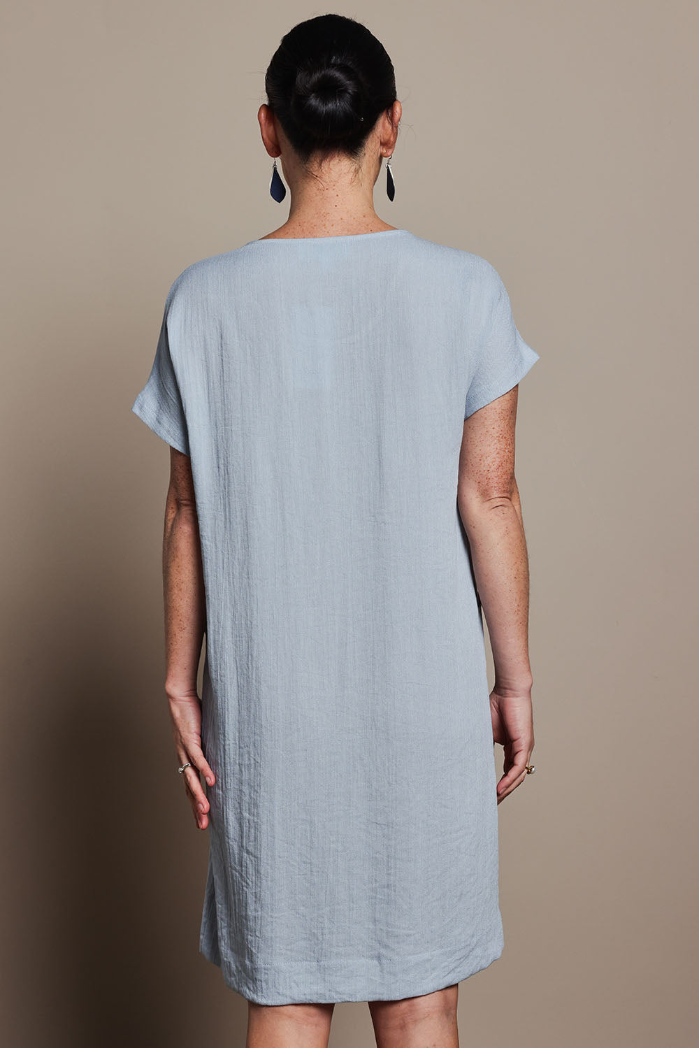 Model Katie wearing size 10 of the Viscose Linen Short Sleeve Dress in colour Dustyblue (Blue), from the back