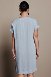 Model Katie wearing size 10 of the Viscose Linen Short Sleeve Dress in colour Dustyblue (Blue), from the back