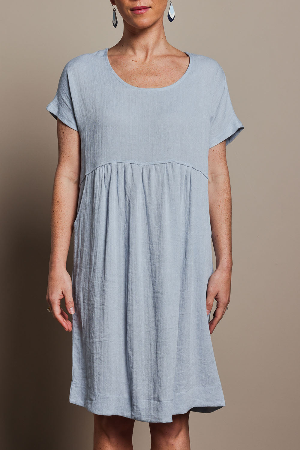 Model Katie wearing size 10 of the Viscose Linen Short Sleeve Dress in colour Dustyblue (Blue), from the front, cropped image