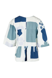 Product shot of the Cotton Tiered Blouse in colour Abstract (Blue), from the back