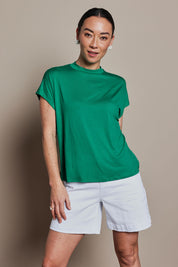 Model Katie wearing size 10 of the Cap Sleeve Tee in colour Green (Green), from the front, cropped image