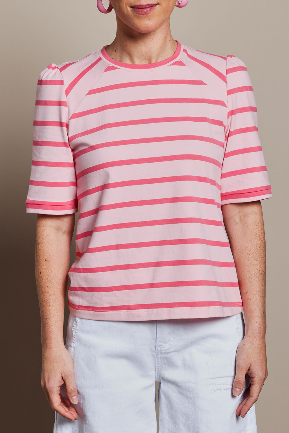 Model Katie wearing size 10 of the Cotton Stripe Puff Sleeve Top in colour Pink (Pink), from the front, cropped image