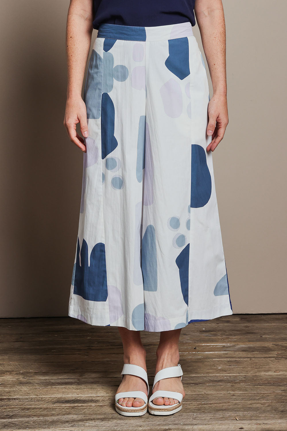 Model Katie wearing size 10 of the Cotton Pull On Pant in colour Abstract (Blue), from the front, cropped image