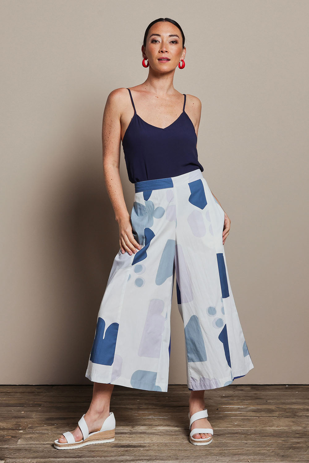 Model Katie wearing size 10 of the Cotton Pull On Pant in colour Abstract (Blue), from the front, showing the whole outfit