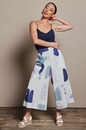 Model Katie wearing size 10 of the Cotton Pull On Pant in colour Abstract (Blue), from the front, showing the whole outfit