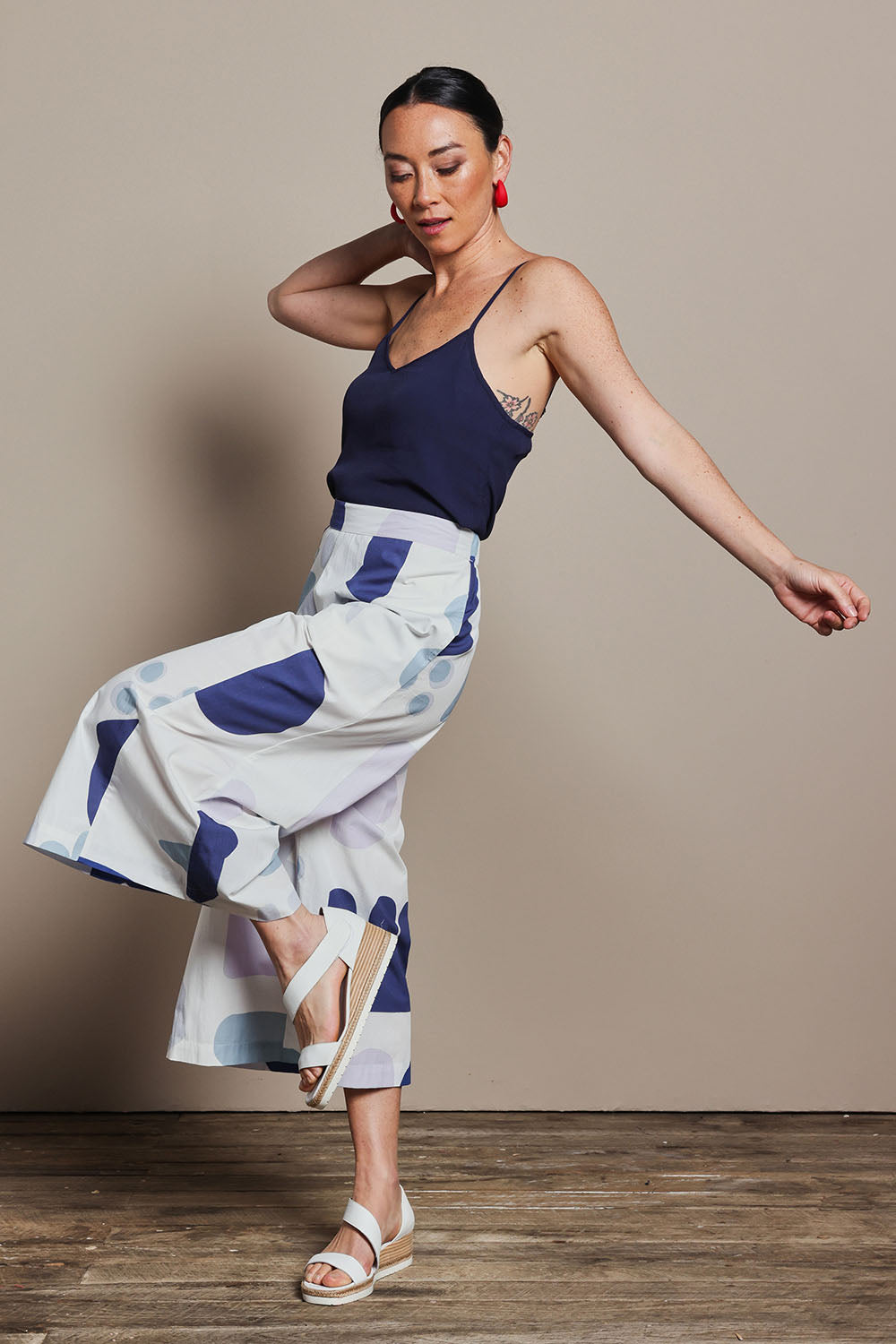 Model Katie wearing size 10 of the Cotton Pull On Pant in colour Abstract (Blue), from the front, showing the whole outfit