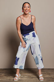 Model Katie wearing size 10 of the Cotton Pull On Pant in colour Abstract (Blue), from the front, showing the whole outfit