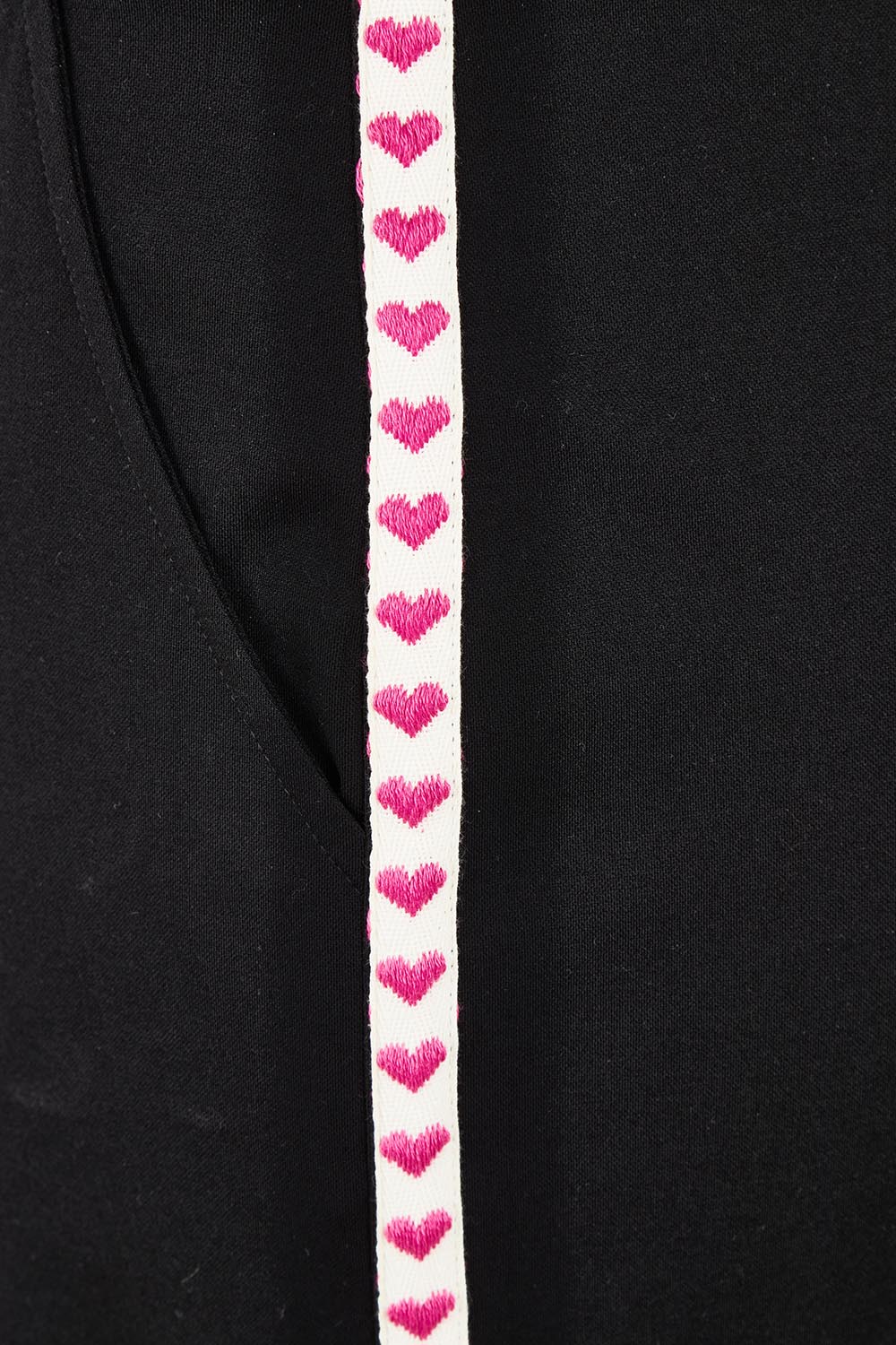Product shot of the Love Trim Pants in colour Black (Black), detail